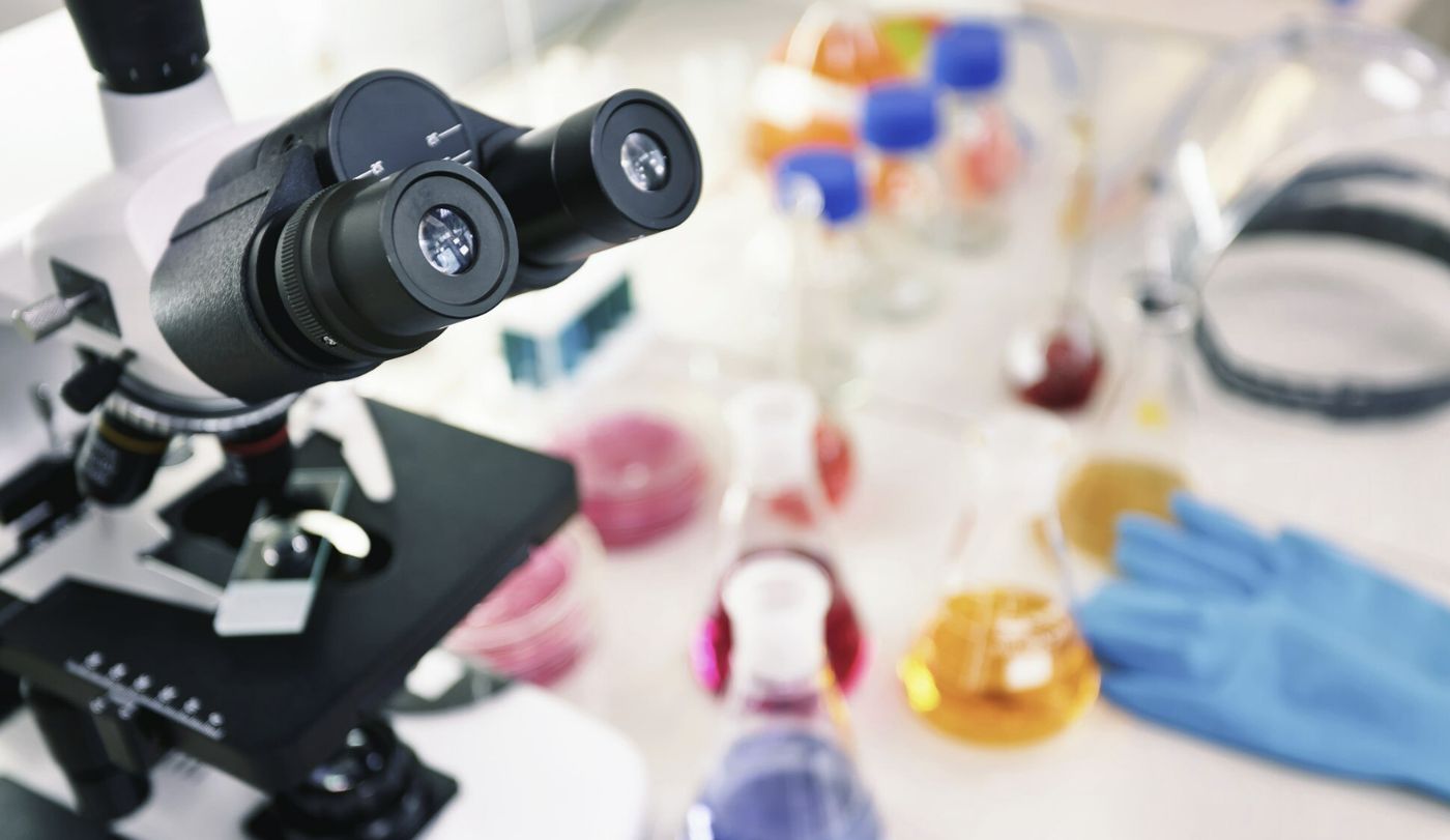 Microscope and laboratory flasks
